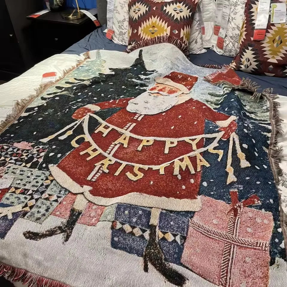 Happy Christmas Santa woven tapestry throw on a bed