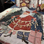 Happy Christmas Santa woven tapestry throw on a bed