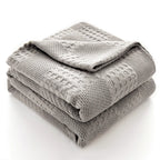 Folded light gray 100% cotton waffle weave blanket