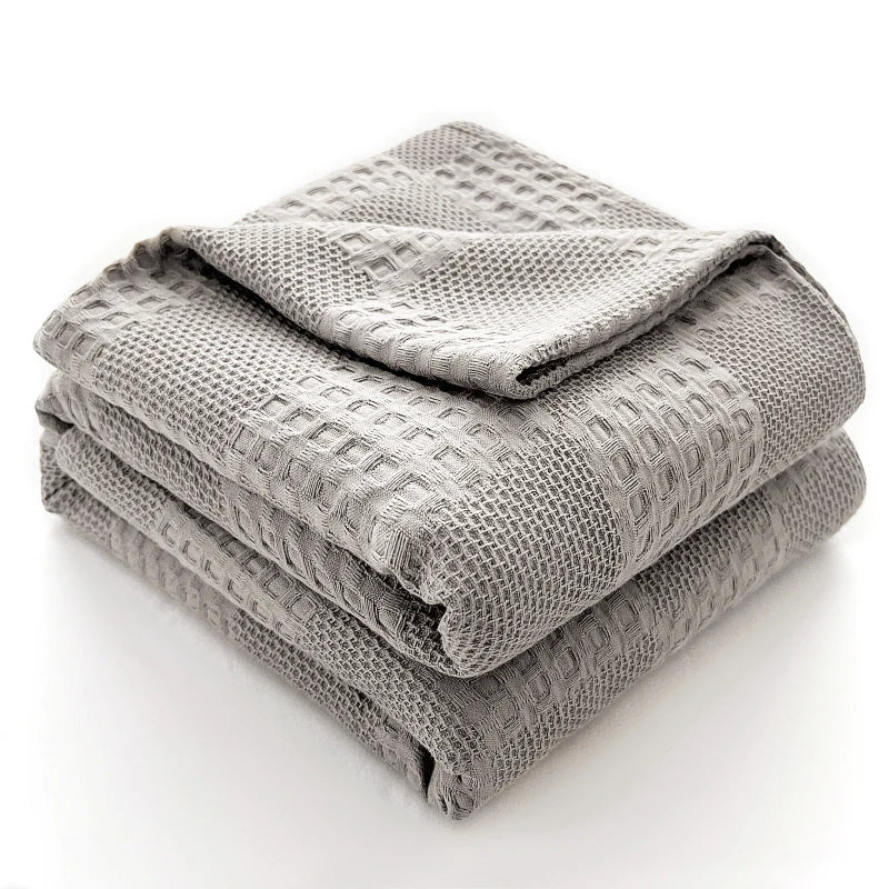 Folded light gray 100% cotton waffle weave blanket