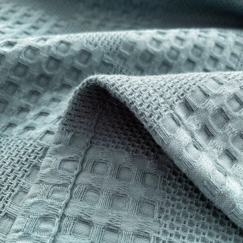Close-up of dusty blue cotton waffle weave