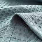 Close-up of dusty blue cotton waffle weave