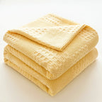 Folded butter yellow 100% cotton waffle weave blanket