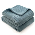 Folded dusty blue 100% cotton waffle weave blanket