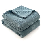 Folded dusty blue 100% cotton waffle weave blanket