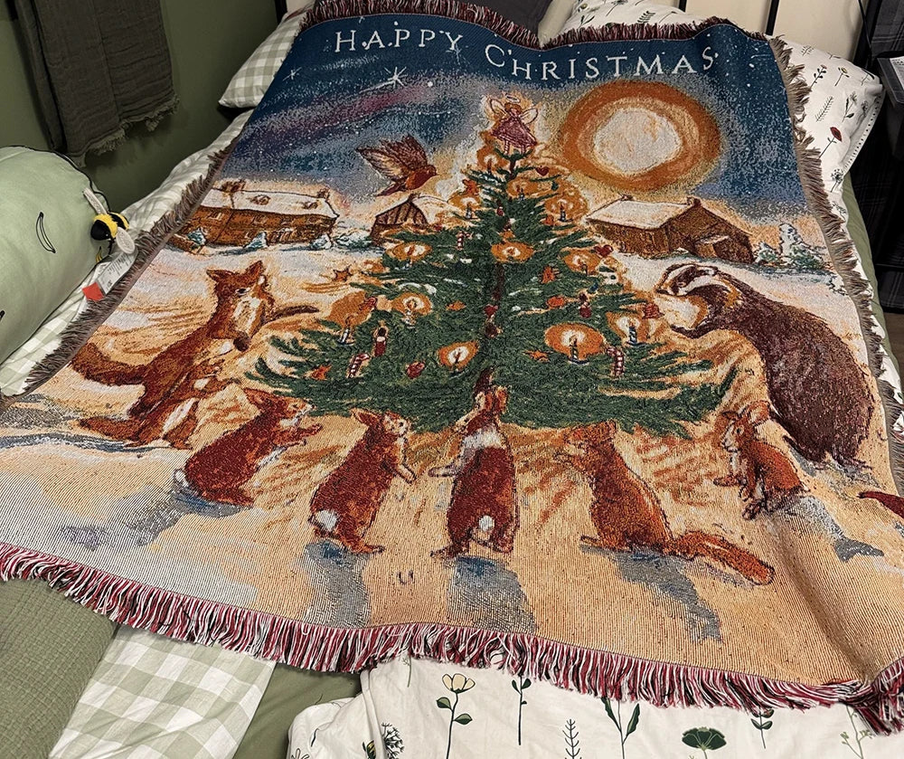 Woodland Christmas woven tapestry throw blanket with fox and badger around a tree