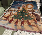 Woodland Christmas woven tapestry throw blanket with fox and badger around a tree
