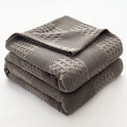 Folded charcoal gray 100% cotton waffle weave blanket